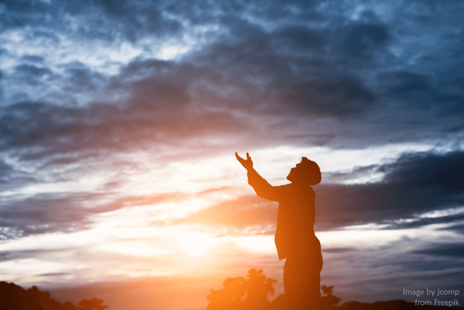 Silhouette of Man Praying