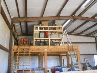 Another of Barn Loft Shelves Loaded with Items