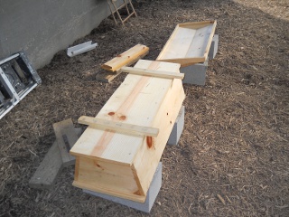 Homemade Top Bar Bee Hive Underside Painting with Water Sealer