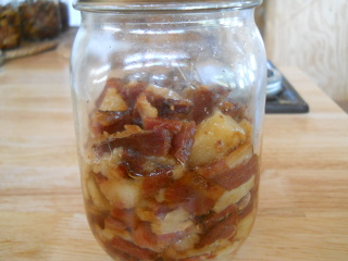 Closeup of Jar of Canned Bacon Pieces
