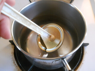 Pulling Lids Out of Pot with Magnet Wand