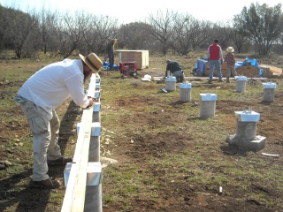 Men Working on Foundation Built-up Beams on Community Work Day