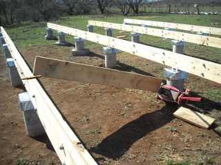 Using Floor Jack to Upright the Torqued Foundation Beams