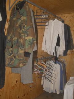 Clothes Hanging Double Stacked in the Bedroom Closet