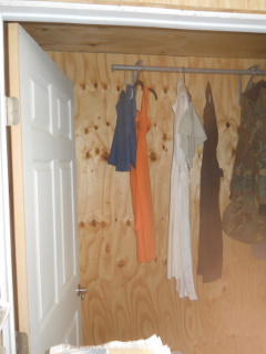 Dresses Hanging in the Bedroom Closet