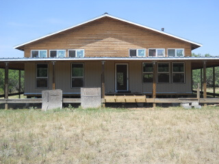 Front of the House with Siding Complete