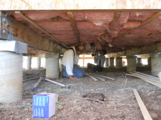 House Floor Installing Insulation Runners