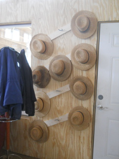 Hats on Homemade Amish Hat Rack During Fellowship Time