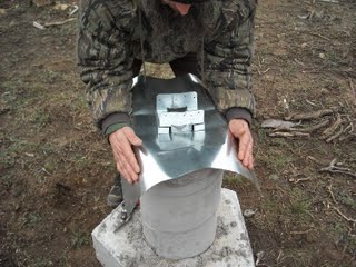 Folding the Sides of the Concrete Pier Homemade Termite Shield