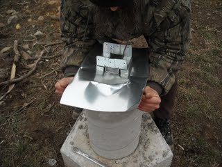 Folding the First Cut Sides of the Concrete Pier Homemade Termite Shield