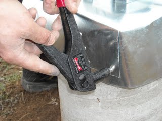 Using Rivet Tool on Concrete Pier Homemade Termite Shield