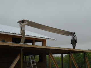 Carrying the Roof Metal on the Porch Roof