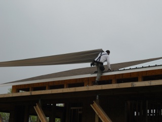 Carrying the Roof Metal onto the Roof