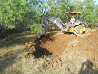 More Backhoe Digging Inner Field Pond
