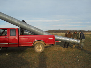 More Unloading Culvert Pipe from Truck