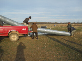 Still More Unloading Culvert Pipe from Truck