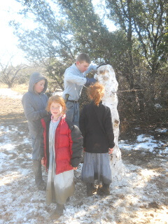 Neighbor Children Building a Snowman