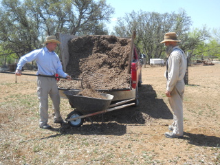 My Brother Kevin Unloading Mulch from the Mulch Carrier