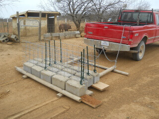Pig fence sections delivered to pig pen