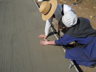 Spring Ranchfest 2012 Betrothed Couple Making Handprints in Concrete of Their Eventual Cabin