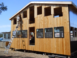 Ranchfest Men Working on the South Side of the Bunker Cottage During