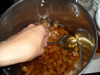 Tilting Pot to Spoon Out Last of Pig Lard