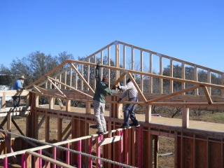 House Roof Truss Lifted into Position
