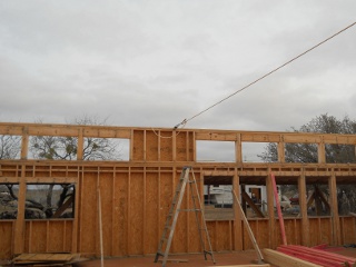 Walls Pulled in Using a Come-Along to Properly Install House Roof Trusses